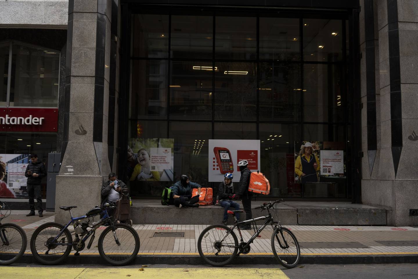 Rappi food delivery workers in Santiago, Chile, on Wednesday, July 13, 2022. Chile's central bank is likely to raise its key interest rate by at least half a percentage point Wednesday as a slump in the peso fuels inflation that is already running at the fastest pace in almost three decades. Photographer: Tamara Merino/Bloomberg