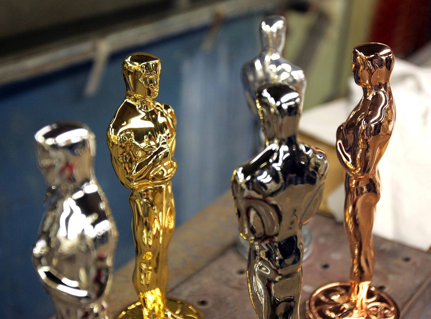 Oscar statuettes in various stages of the plating process are displayed at the R.S. Owens factory in Chicago, Illinois, U.S., on Thursday, Jan. 10, 2008. For most people the Academy Awards are about fancy dresses, weepy actresses and mind-numbingly long speeches. But don't forget that the Oscars are also one of the best betting events of the year. Photographer: Tim Boyle/Bloomberg News