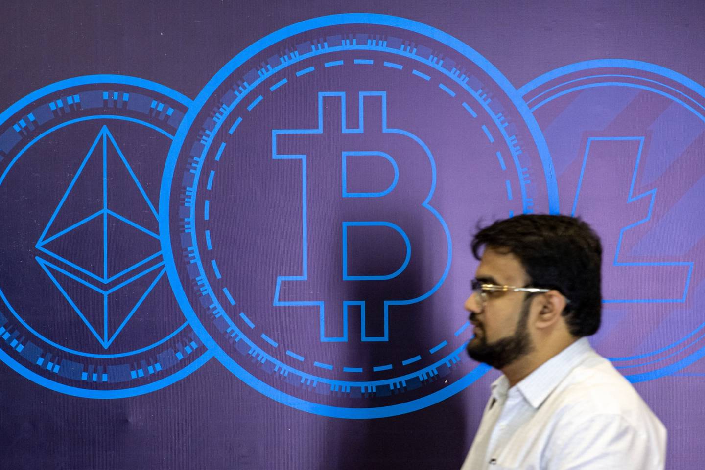 The Ethereum, left, Bitcoin, center, and Litecoin logos on an event board during the Dubai Crypto Expo at the Festival Arena in Dubai, United Arab Emirates, on Wednesday, Oct. 5, 2022.