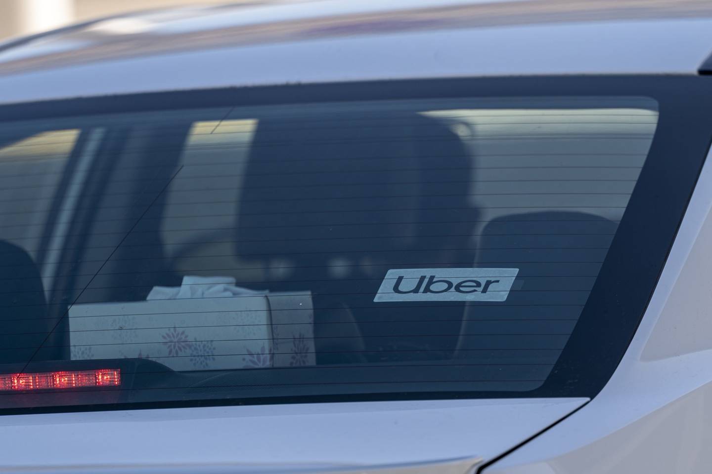 Uber signage on a vehicle at Oakland International Airport in Oakland, California.