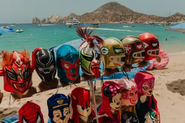 Luchador masks displayed for sale at Medano Beach in Cabo San Lucas, Baja California Sur state, Mexico, on Saturday, June 24, 2023. Mexico kept borrowing costs unchanged for a second straight month as the central bank vows to maintain its restrictive stance over the coming months while inflation continues to show signs of cooling. Photographer: Mariceu Erthal/Bloomberg
