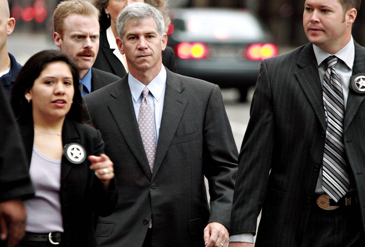 Andrew Fastow is escorted by U.S. Marshals to the Bob Casey Federal Courthouse in Houston, Texas, in 2006. Photographer: F. Carter Smith/Bloombergdfd