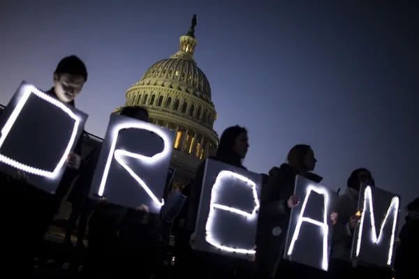 Demonstrators hold illuminated signs during a rally supporting the Deferred Action for Childhood Arrivals program (DACA), or the Dream Act, outside the US Capitol building in Washington, D.C.