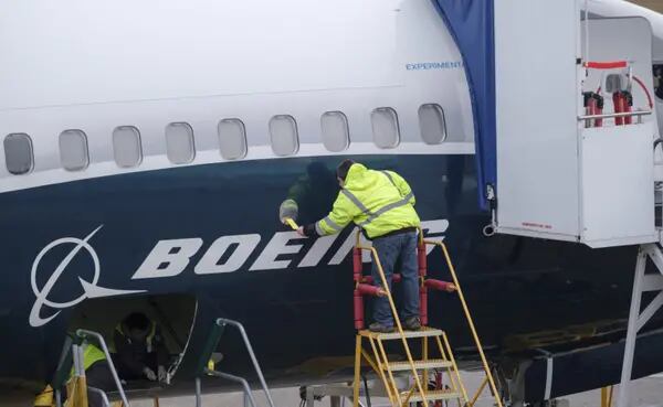 RENTON, WA - MARCH 14: An employee works on the fuselage of a Boeing 737 MAX 9 test plane. outside the company's factory, on March 14, 2019 in Renton, Washington. The 737 MAX, Boeing's newest model, has been been grounded by aviation authorities throughout the world after the crash of an Ethiopian Airlines 737 MAX 8 on March 10. (Photo by Stephen Brashear/Getty Images) Photographer: Stephen Brashear/Getty Images