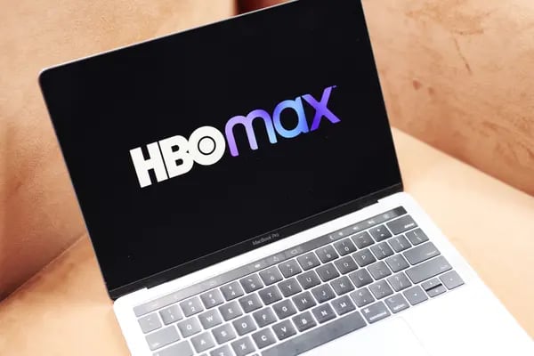 Signage for the AT&T Inc. WarnerMedia HBO Max streaming service is displayed on a laptop computer in an arranged photograph taken in the Brooklyn Borough of New York, U.S., on Thursday, May 28, 2020. About 90,000 people downloaded the HBO Max mobile app on its first day, Wednesday, according to the measurement firm SensorTower Inc. Photographer: Gabby Jones/Bloomberg