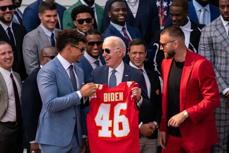 Patrick Mahomes, quarterback for the Kansas City Chiefs, left, and Travis Kelce, tight end for the Kansas City Chiefs, right, present the US President Joe Biden with a personalized Kansas City Chiefs jersey during a ceremony on the South Lawn of the White House in Washington, DC, US, on Monday, June 5, 2023. The Chiefs defeated the Philadelphia Eagles 38-35 at Super Bowl LVII in Glendale, Arizona, on February 12. Photographer: Nathan Howard/Bloombergdfd