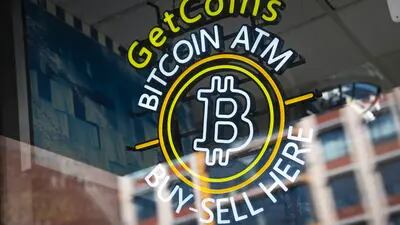 Bitcoin signage for an automated teller machine (ATM) at a gas station in Washington, D.C., U.S., on Monday, Feb. 28, 2022. Cryptocurrencies appear to be kicking off the week with a more positive outlook than U.S. stocks, just as some strategists are predicting the recent high correlation between the two may begin to ease. Photographer: Sarah Silbiger/Bloomberg
