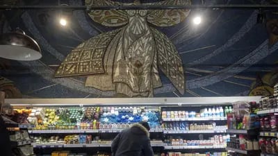 A Soviet era mosaic above an aisle of a grocery store in Mariupol.