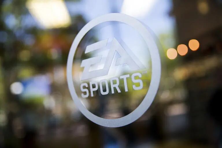 The Electronic Arts Inc. (EA) Sports logo is displayed at the company's Tiburon facility in Orlando, Florida, U.S., on Friday, June 5, 2015. The U.S. women's national soccer team will be one of 12 female squads in the next release of EA Sports' FIFA video game. It's the first time the world's highest-selling sports video game franchise has included female players. Photographer: Edward Linsmier/Bloombergdfd