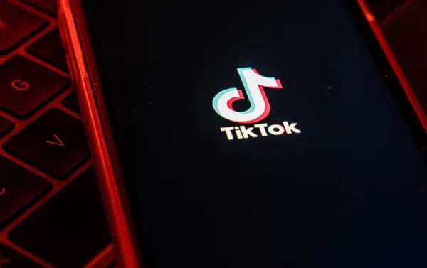 The logo for ByteDance Ltd.'s TikTok app is arranged for a photograph on a smartphone in Hong Kong. Photographer: Lam Yik/Bloomberg