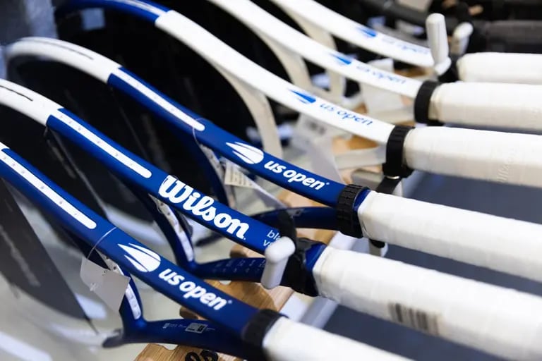 Wilson logos on tennis rackets at Paragon Sports store in the Chelsea neighborhood of New York, US, on Thursday, Jan. 4, 2024. Amer Sports Inc., the company behind sporting goods brands Wilson, Salomon and Arc'teryx, has filed for a US initial public offering. Photographer: Jeenah Moon/Bloombergdfd