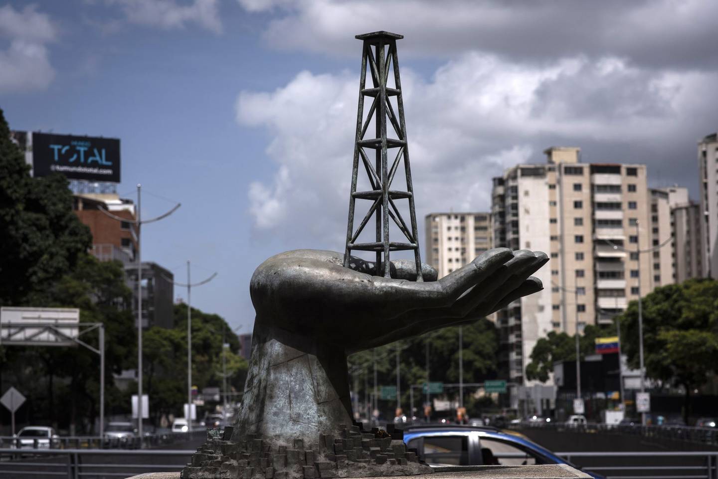 A sculpture, depicting an oil derrick in a hand, outside the Petroleos de Venezuela SA (PDVSA) headquarters in Caracas, Venezuela, on Wednesday, Aug. 31, 2022. Venezuelan Oil Minister El Aissami made a request through the prosecutor's office for the extradition of ex-minister, Rafael Ramirez, for allegedly defrauding state oil company PDVSA.