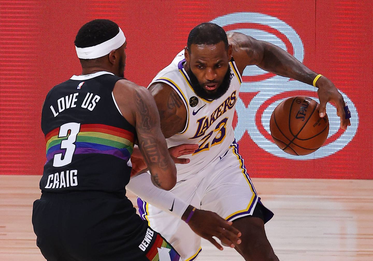 LeBron James #23 of the Los Angeles Lakers drives the ball against Torrey Craig #3 of the Denver Nuggets during the second quarter in Game Three of the Western Conference Finals during the 2020 NBA Playoffs at AdventHealth Arena at the ESPN Wide World Of Sports Complex on September 22, 2020 in Lake Buena Vista, Florida.