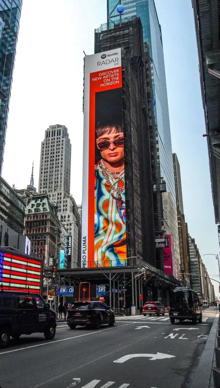Peso Pluma's image on a billboard in New York City.dfd