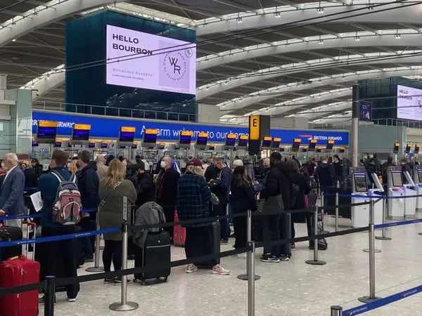 Travelers queue to check-in at Heathrow Terminal 5 on April 4.