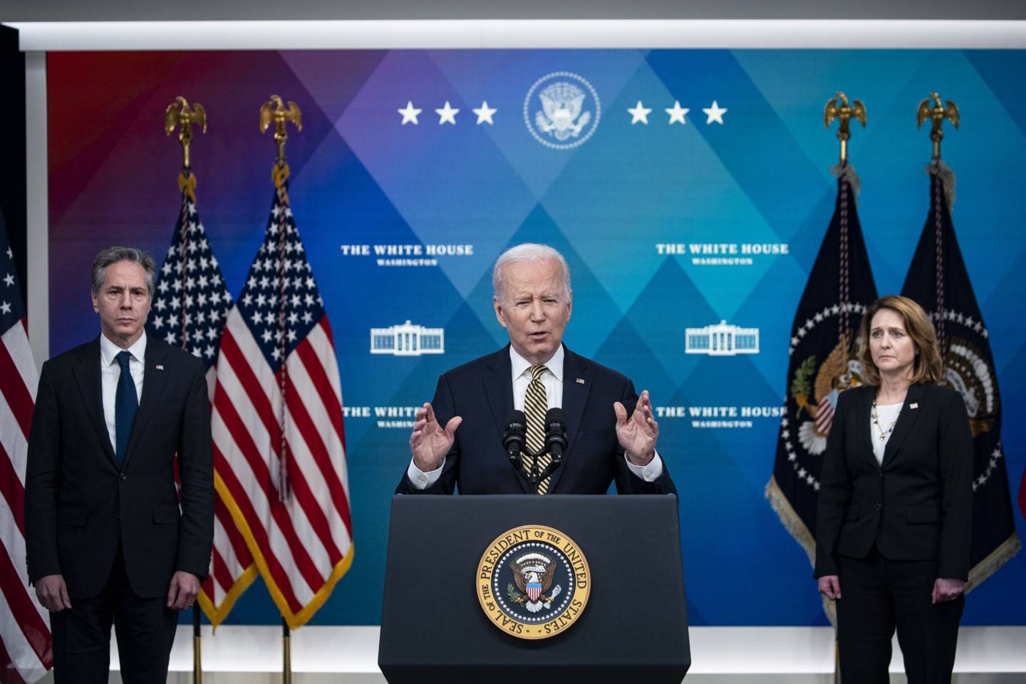 U.S. President Joe Biden speaks as Kathleen Hicks, deputy secretary of defense, right, and Antony Blinken, U.S. secretary of state, listen in the Eisenhower Executive Office Building in Washington, D.C., U.S., on Wednesday, March 16, 2022. Biden outlined the United States' assistance to Ukraine following an emotional appeal from Ukrainian President Volodymyr Zelenskiy for Biden to lead the world in punishing Moscow for its invasion. Photographer: Al Drago/Bloomberg