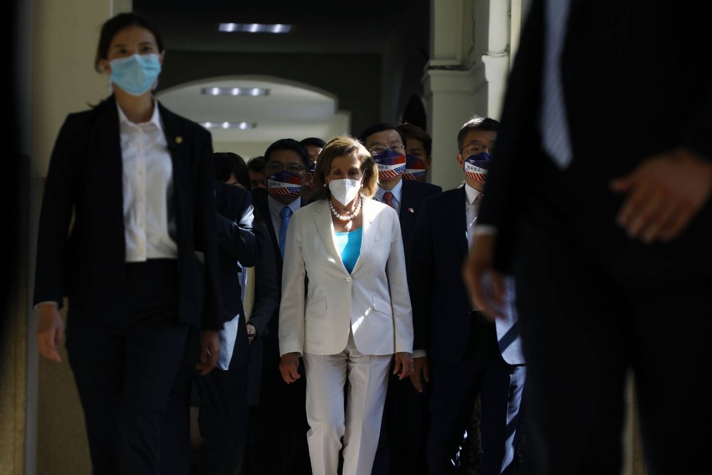 US House Speaker Nancy Pelosi, center, arrives at the Legislative Yuan in Taipei, Taiwan, on Wednesday, Aug. 3, 2022. Pelosi became the highest-ranking American politician to visit Taiwan in 25 years, prompting China to announce missile tests and military drills encircling the island that set the stage for some of its most provocative actions in decades.dfd