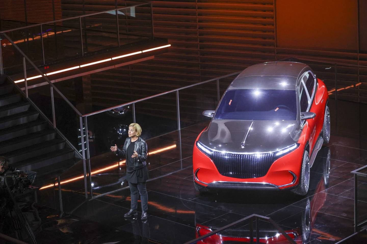 Britta Seeger, a member of Daimler's management board, speaks while unveiling the Mercedes-Maybach EQS. The bulky luxury SUV includes massive amounts of chrome, 24-inch Bowl rims on its wheels and a first-class rear suite with two individual seats, the customary champagne holder and cooling box, and a high-end sound and visual entertainment system. According to Mercedes, a non-Maybach EQS electric SUV will debut in 2022, with the Mercedes-Maybach EQS likely to follow. Photographer: Alex Kraus/Bloombergdfd