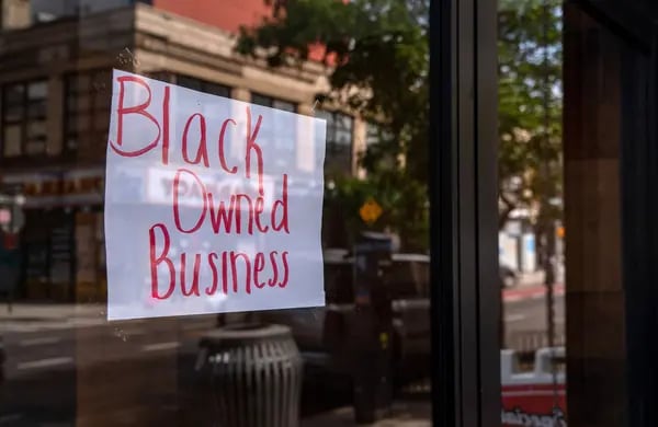A "Black-Owned Business" sign is displayed in the window of a restaurant in the Bedford-Stuyvesant neighborhood in the Brooklyn borough of New York.