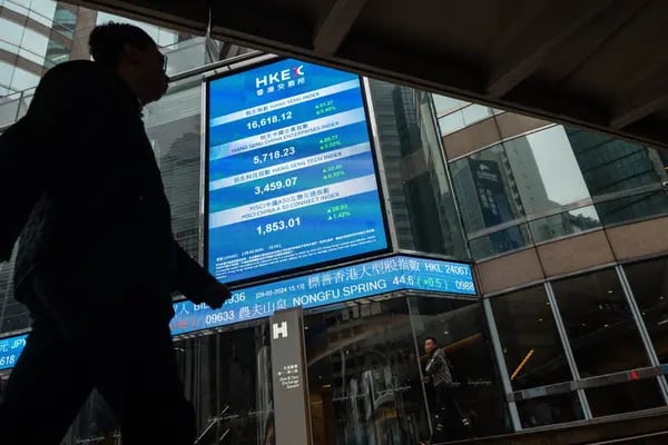An electronic ticker at the Exchange Square Complex, which houses the Hong Kong Stock Exchange, in Hong Kong, China, on Thursday, Feb. 29, 2024. Hong Kongs stock exchange posted a 13% decline in fourth quarter profit as trading declined and initial public offerings remained weak. Photographer: Chan Long Hei/Bloomberg