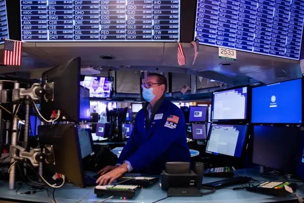 A trader working in the New York Stock Exchange (NYSE).