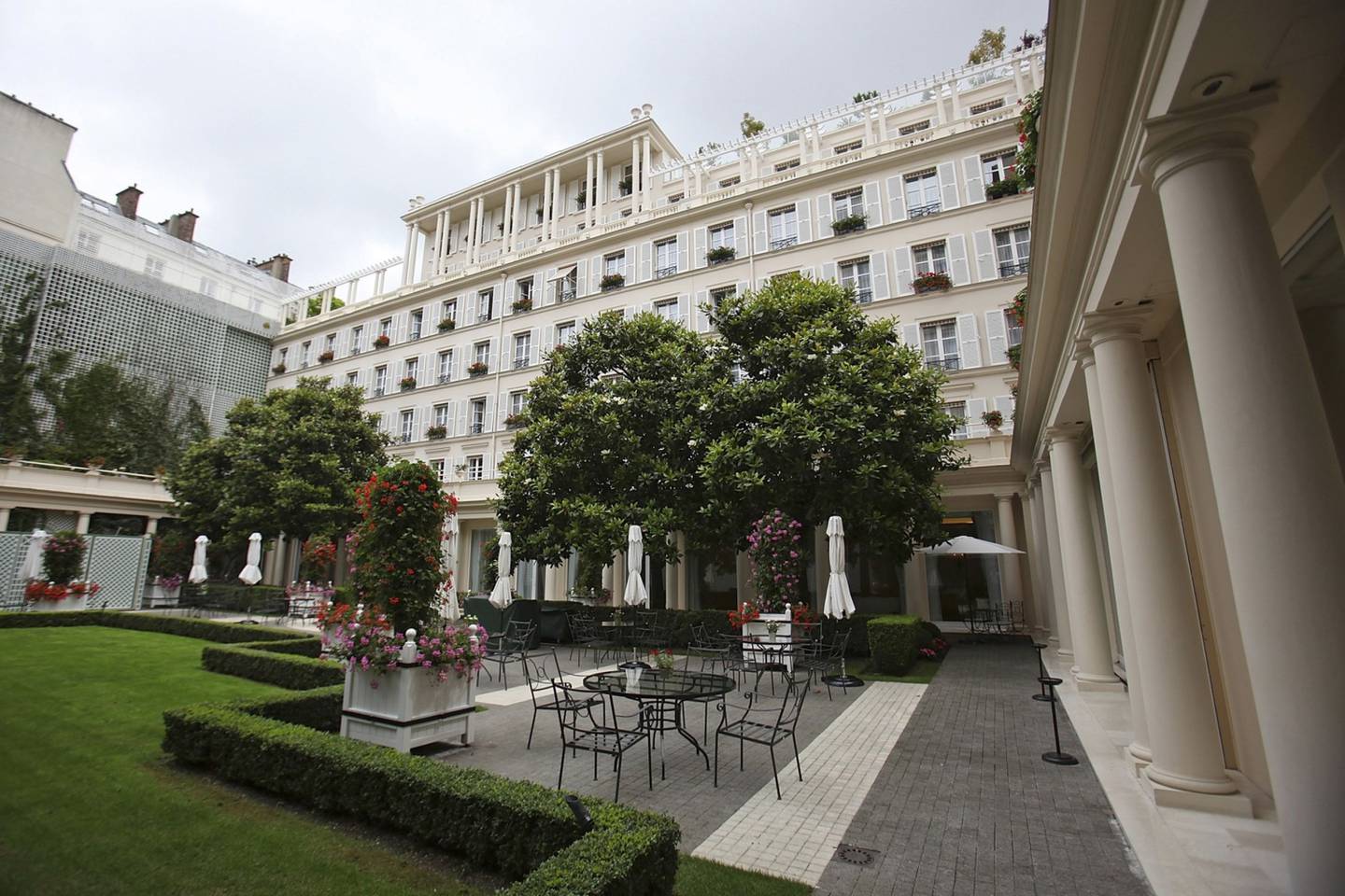 Trees line the garden at Le Bristol hotel in Paris, France, on Tuesday, June 14, 2011. Eight deluxe French hotels were crowned with the rare distinction of "palace" status in May, a new industry classification for luxury that goes beyond a mere five stars. Four Paris hotels, the Bristol, the Meurice, the Park Hyatt and the Plaza Athenee made the list. Photographer: Simon Dawson/Bloombergdfd