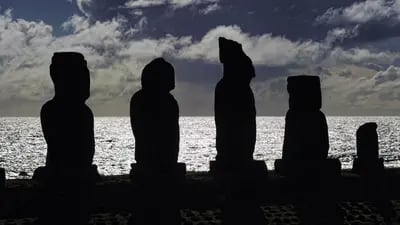 Stone statues of the Rapa Nui culture against the light on Easter Island, 3700 km off the Chilean coast in the Pacific Ocean Photographer: Martin Bernetti/AFP/Getty Images