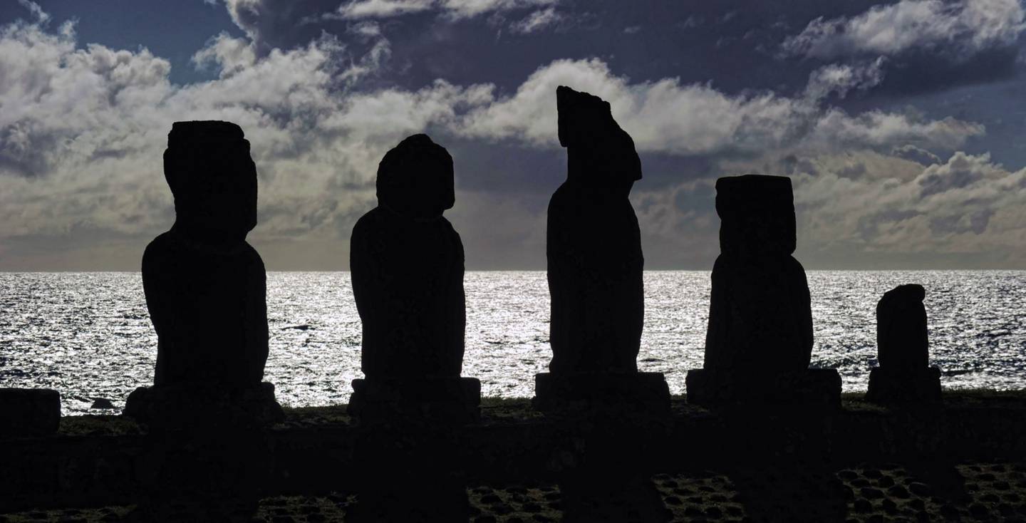 Stone statues of the Rapa Nui culture against the light on Easter Island, 3700 km off the Chilean coast in the Pacific Ocean Photographer: Martin Bernetti/AFP/Getty Imagesdfd