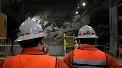Employees stand inside the Codelco Metals Inc. Teniente copper mine near Rancagua, Chile.