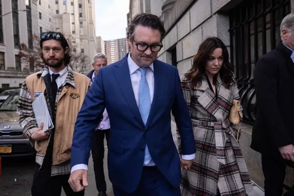 Trevor Milton, founder of Nikola Corp., center, exits court in New York, US, on Monday, Dec. 18, 2023. Milton was ordered to spend four years behind bars for lying to shareholders about the electric-truck maker's progress. Photographer: Yuki Iwamura/Bloomberg