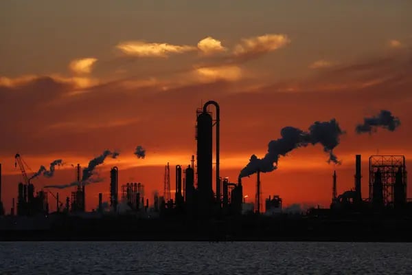 Emissions rise from an oil refinery