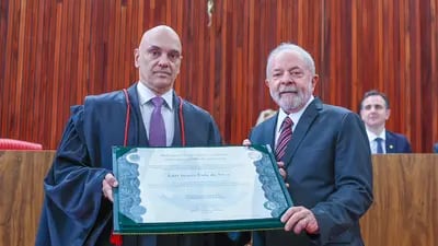 Lula (right) gets was certified as president-elect by Brazil's Electoral Court, headed by Justice Alexandre de Moraes (left).