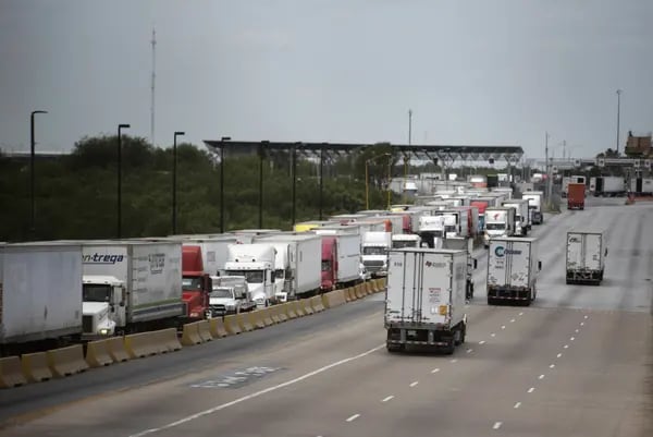 Trucks travel across the World Trade International Bridge in Laredo, Texas.