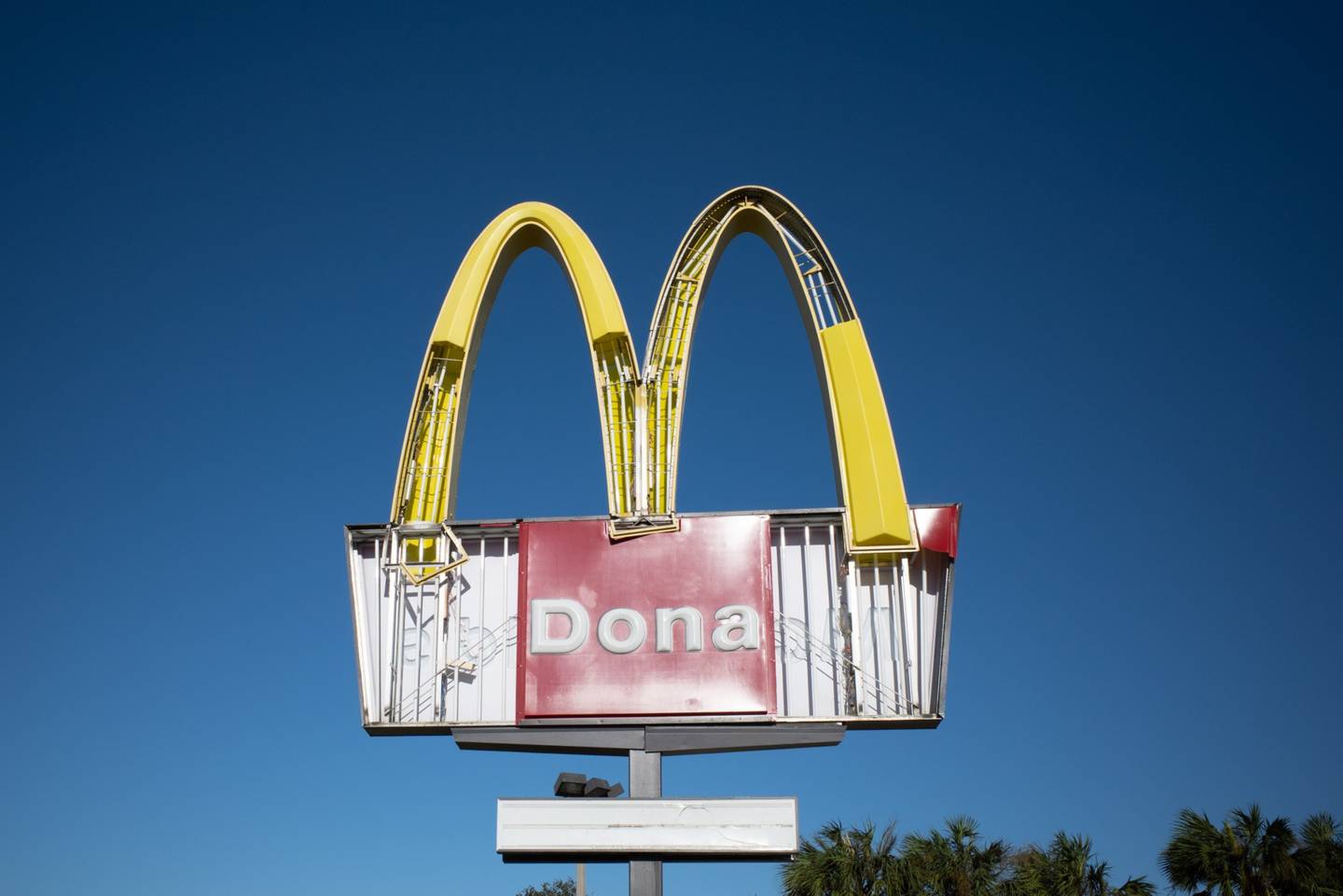 McDonald's signage damaged outside a restaurant following Hurricane Ian in Venice, Florida, where 2 million electricity customers remained without power as of Friday morning.