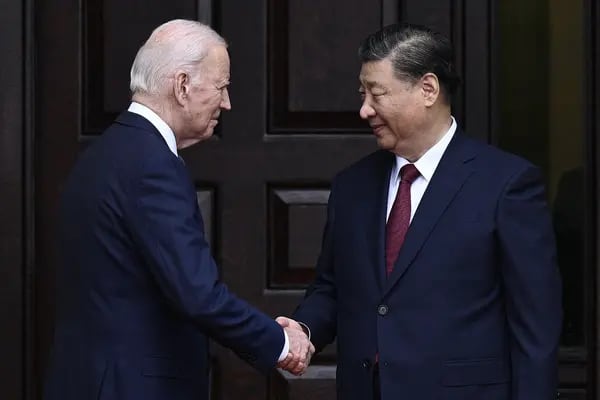 Joe Biden shakes hands with Xi Jinping in Woodside, California, on Nov. 15. Photographer: Brendan Smialowski/AFP/Getty Images