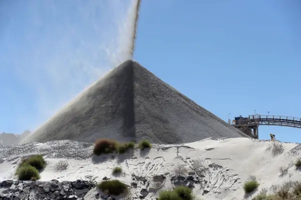 Lithium ore falls onto a stockpile in Port Hedland, Western Australia.