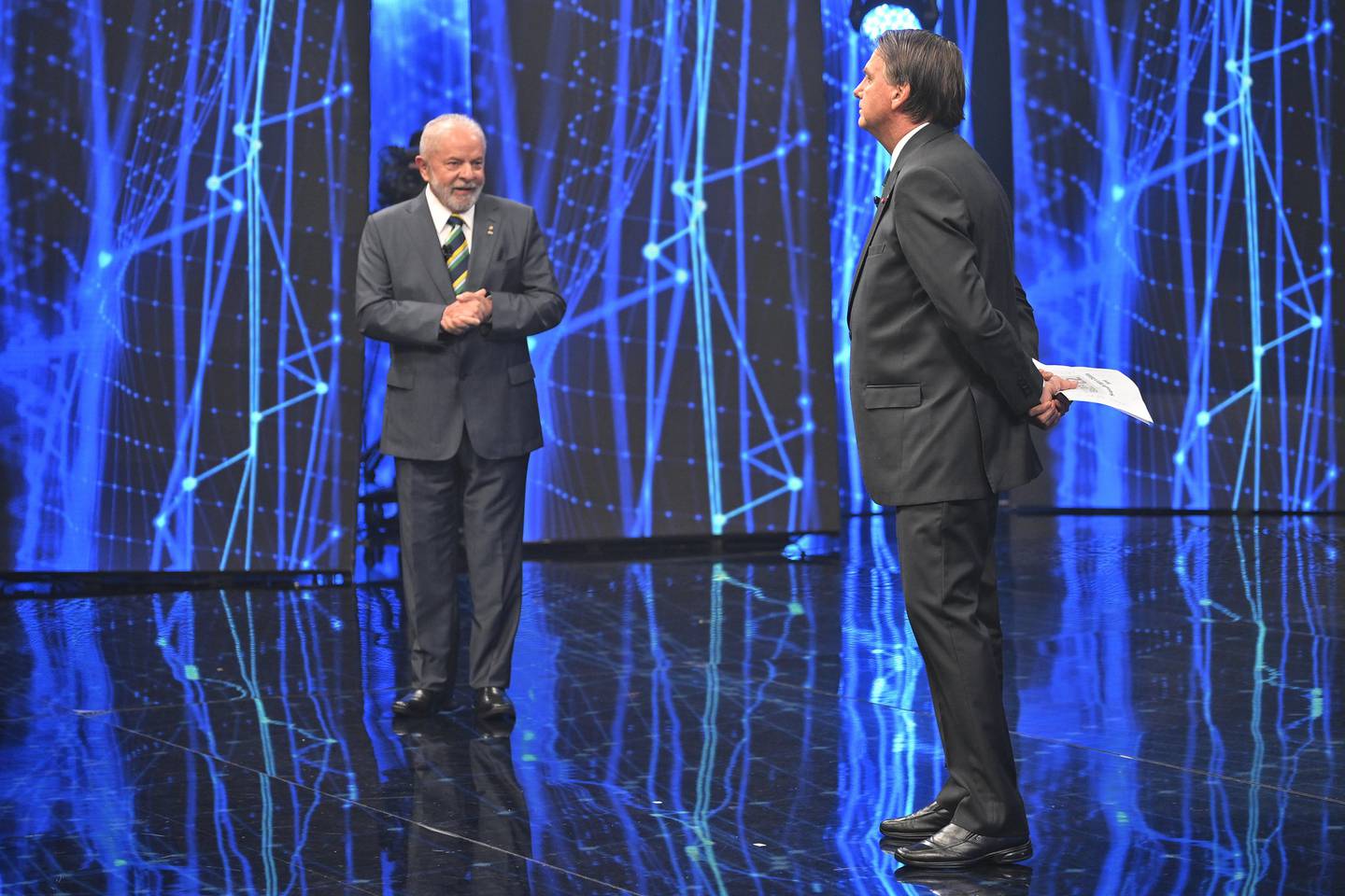 El expresidente brasileño Luiz Inacio Lula da Silva y el actual mandatario Jair Bolsonaro, en el debate televisivo