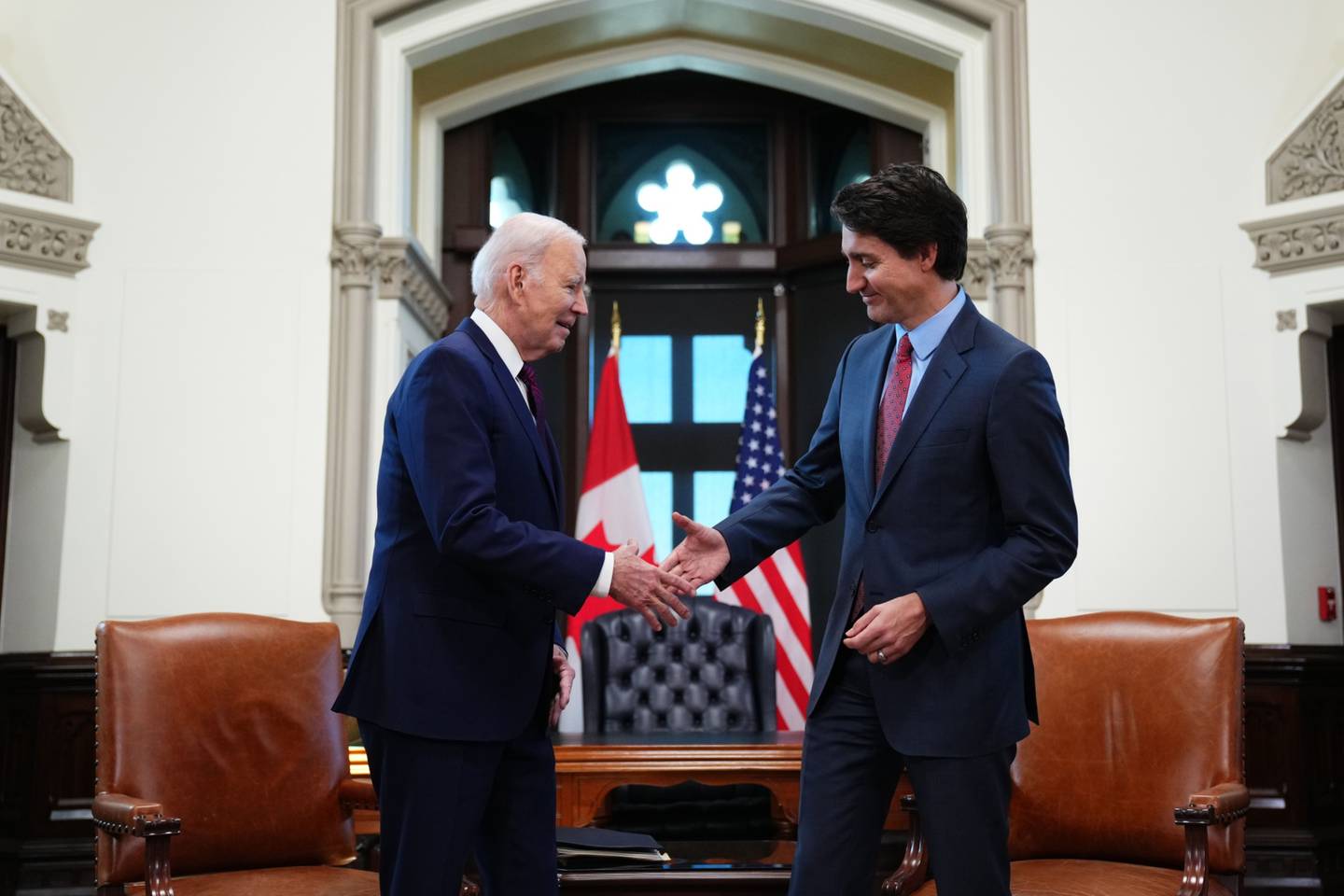 US President Joe Biden, left, prepares to shake hands with Justin Trudeau, Canada's prime minister, ahead of a bilateral meeting on Parliament Hill in Ottawa, Ontario, Canada, on Friday, March 24, 2023. Photographer: Sean Kilpatrick/Canadian Press/Bloomberg