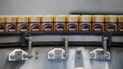 Jars of Nescafe Gold instant coffee granules move along the production line at Nestle SA's Nescafe plant in Orbe, Switzerland, on Thursday, May 20, 2021. Nestle SA sales grew at more than twice the rate analysts expected as the Swiss food giant sold more Nespresso capsules to people working from home and restaurants in Asia stocked up as they started reopening. Photographer: Stefan Wermuth/Bloomberg