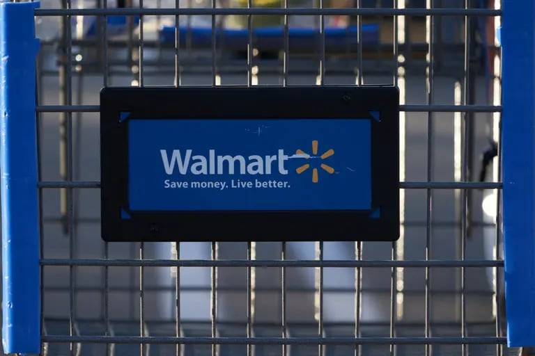 A shopping cart outside a Walmart store in Torrance, California, US, on Sunday, May 15, 2022. Walmart Inc. is scheduled to release earnings figures on May 17. Photographer: Bing Guan/Bloombergdfd