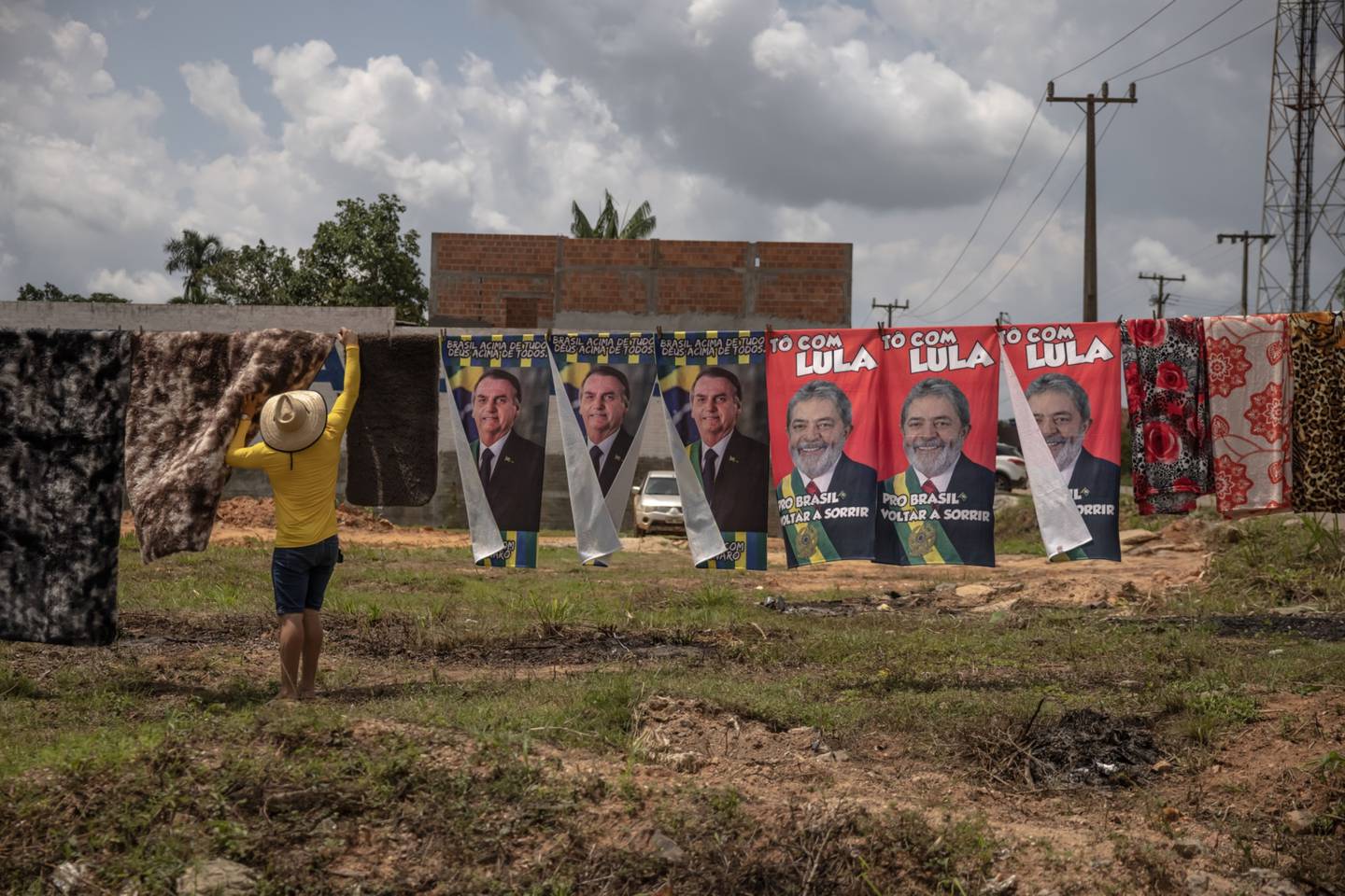 A street vendor sells towels with images of Jair Bolsonaro, Brazil's president, and Luiz Inacio Lula da Silva, Brazil's former president, near Eldorado dos Carajas, Para state.