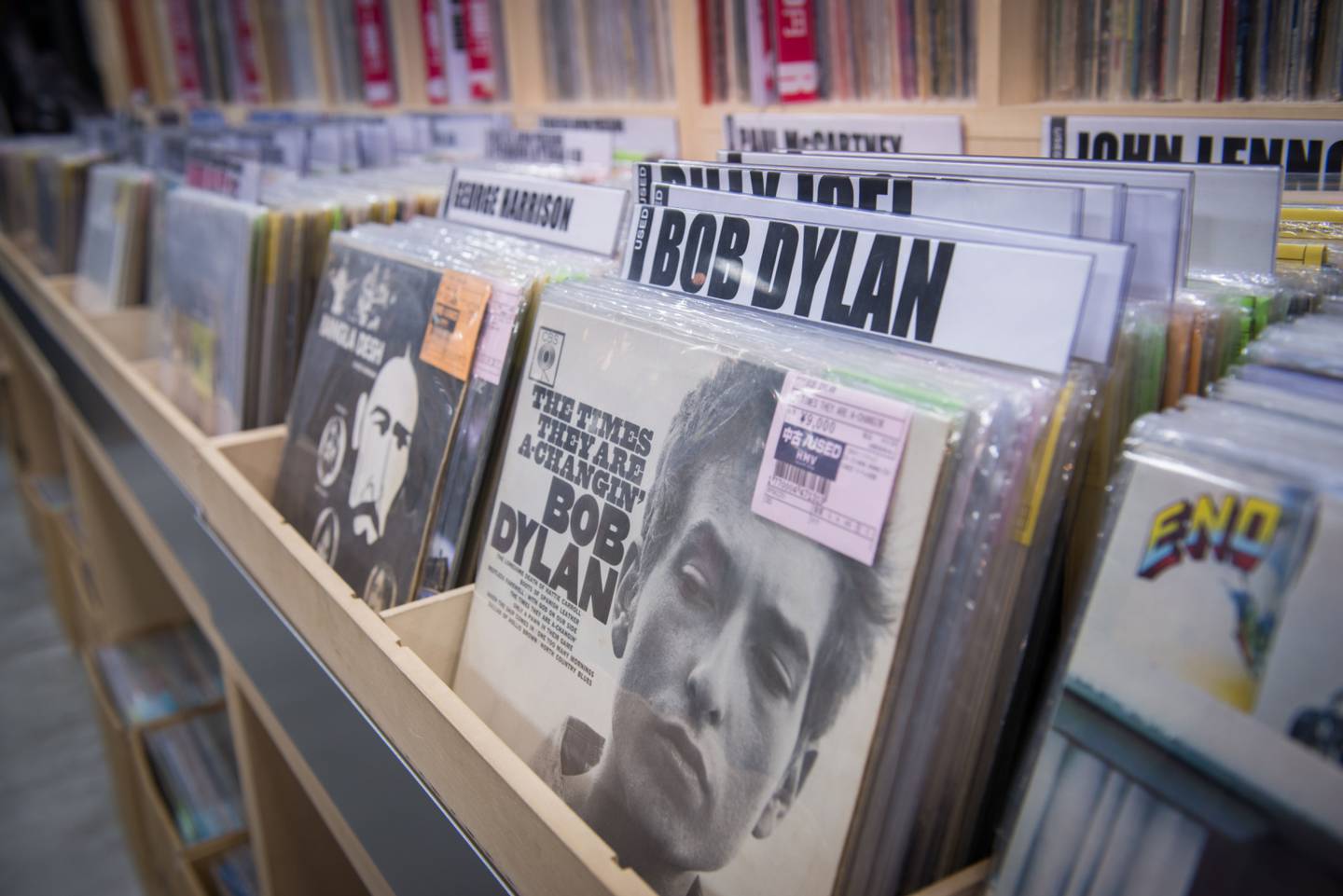 Vinyl records, including Bob Dylan's "The Times They Are A-Changin'," are displayed for sale at the HMV Record Shop operated by Lawson HMV Entertainment Inc. in the Shibuya district of Tokyo, Japan, on Wednesday, Sept. 28, 2016. Spotify Ltd. is bringing its popular online music service to Japan, a large and lucrative market where fans have demonstrated a continuing fondness for CDs and even vinyl records. Photographer: Noriko Hayashi/Bloomberg