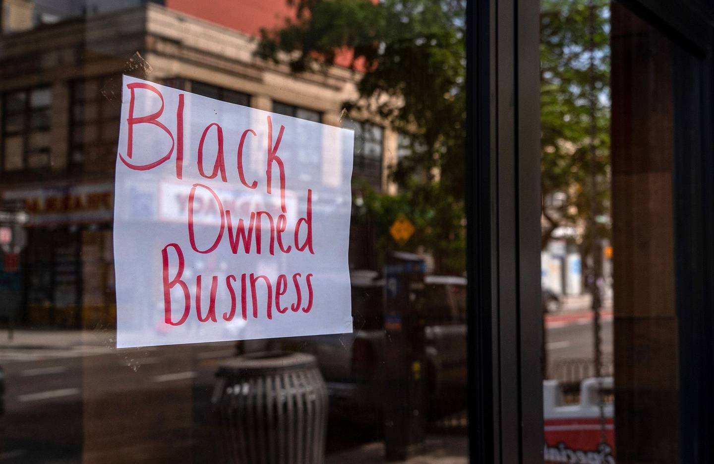 A "Black Owned Business" sign is displayed in the window of a restaurant in the Bedford-Stuyvesant neighborhood in the Brooklyn borough of New York.
