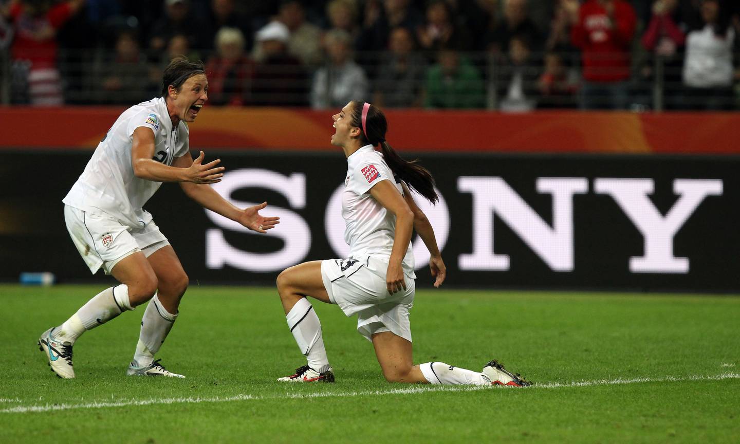 Alex Morgan, right, of USA celebrates after she scores a goal in 2011.