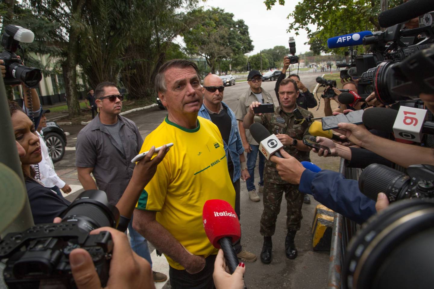 Jair Bolsonaro speaks to members of the media after casting a ballot at a polling station during the presidential elections in Rio de Janeiro, Brazil, on Oct. 2.dfd