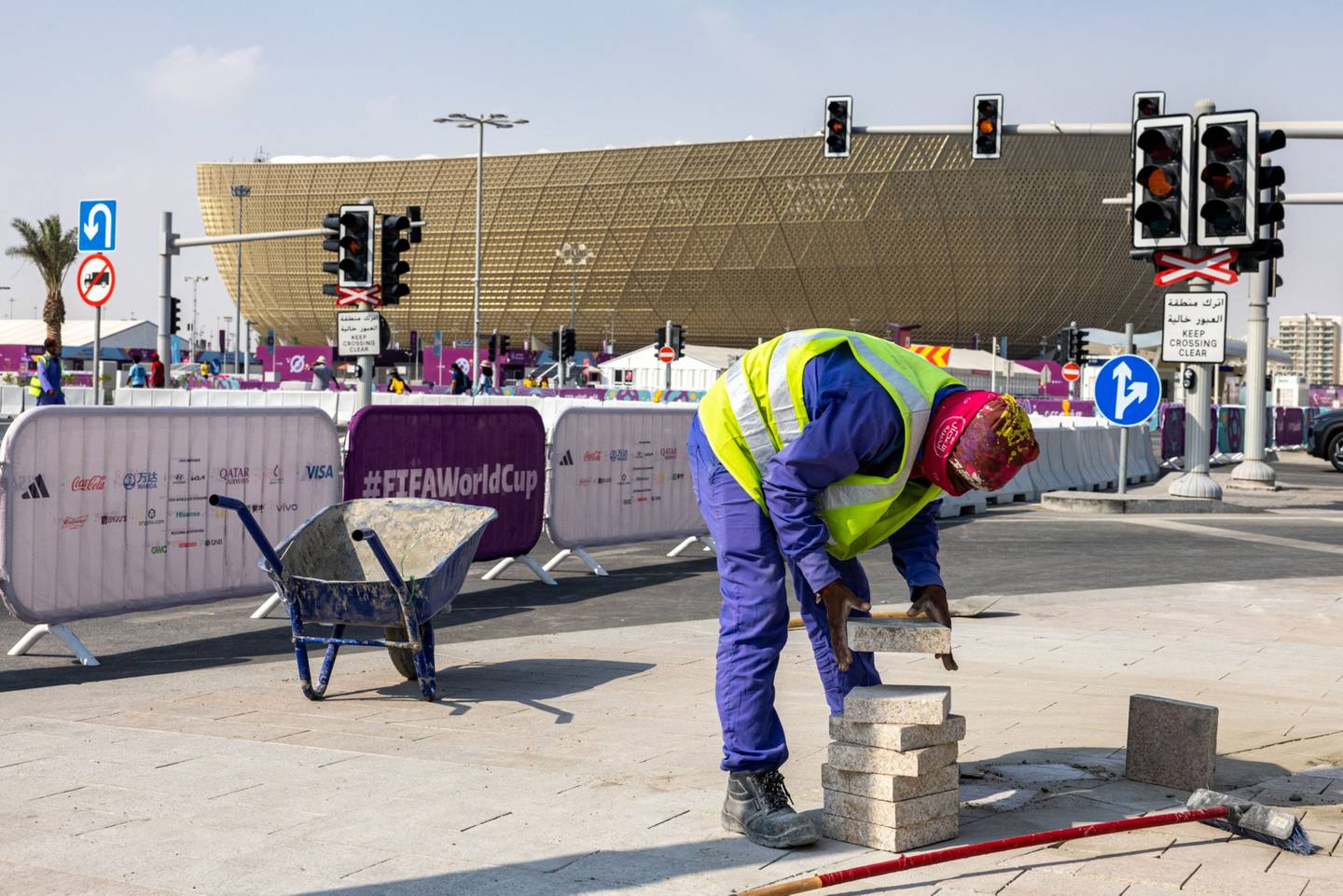 A laborer works outside Lusail Stadium in Doha, Qatar.