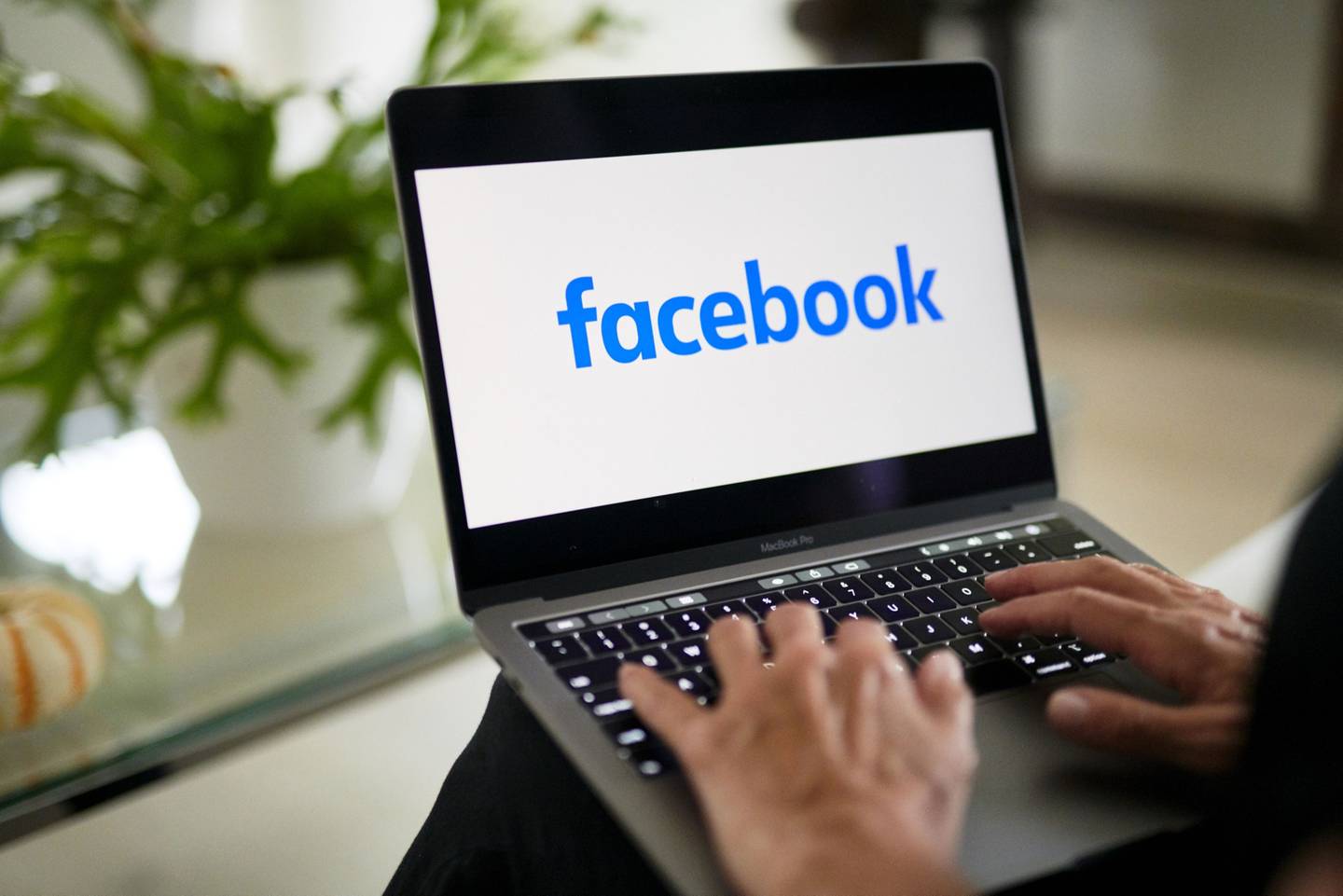 The logo for Facebook is displayed on a laptop computer in an arranged photograph taken in Little Falls, New Jersey.