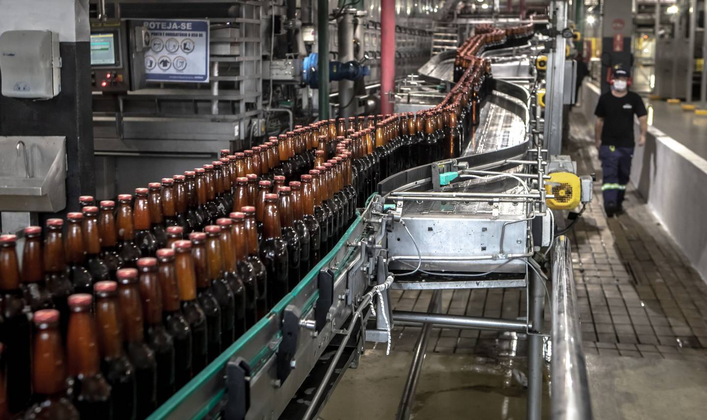 The beer production line at the Ambev SA bottling facility in Sao Paulo, Brazil, on Thursday, Nov. 5, 2020. Ambev, the unit of Anheuser-Busch InBev that operates in 16 countries, said its Brazil beer volume surged 25% in the third quarter from a year earlier after Brazilians used emergency stipends to boost sales. Photographer: Jonne Roriz/Bloomberg