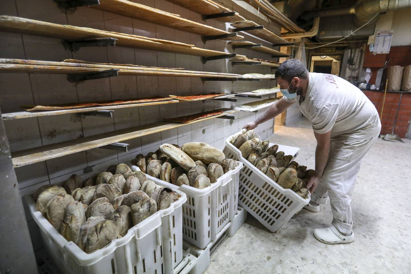 Loaves of freshly-baked bread stored in crates at a bakery in Rome, Italy, on Wednesday, March 9, 2022. Wheat futures swung wildly between gains and losses Tuesday after climbing to unprecedented heights as Russia's attack on Ukraine disrupts global food supplies. Photographer: Alessia Pierdomenico/Bloomberg