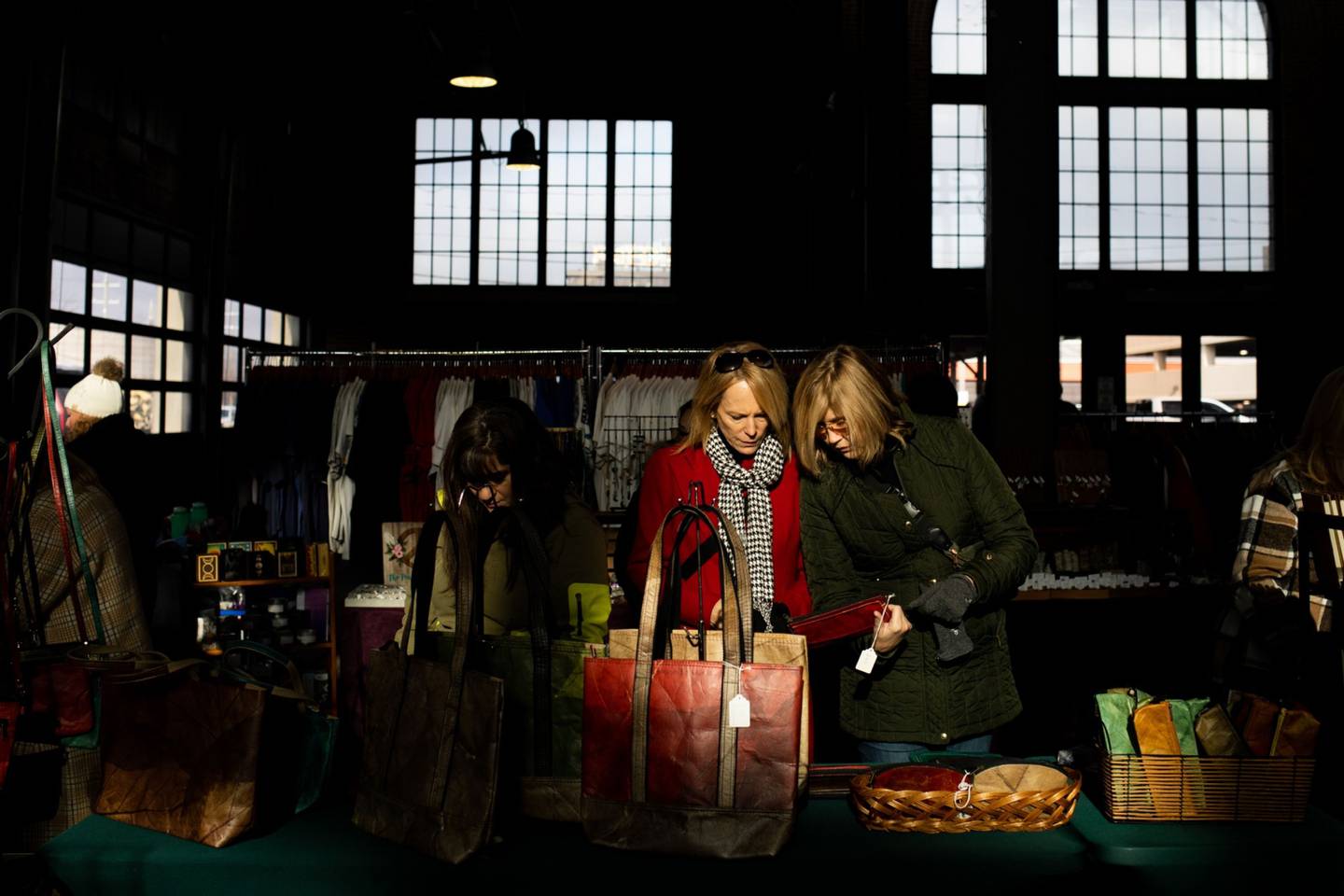 Shoppers at a holiday market in Eastern Market in Detroit, Michigan, US, on Sunday, Dec. 11, 2022. US consumer confidence fell in November to a four-month low amid the double blow of persistent inflation and rising interest rates. Photographer: Emily Elconin/Bloomberg